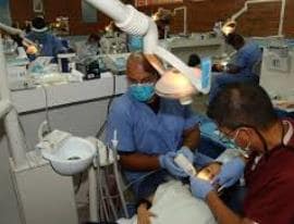 dentist assisting patient